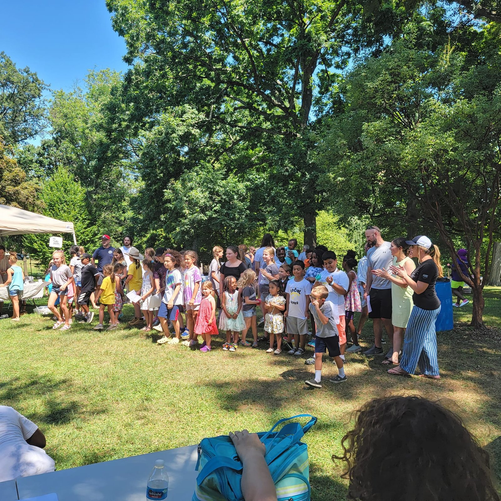 Kids enjoying microgreen samples at a farmers market in Pennsylvania